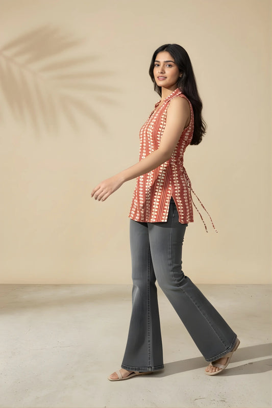 Side profile of watermelon red corset top showing fitted waist