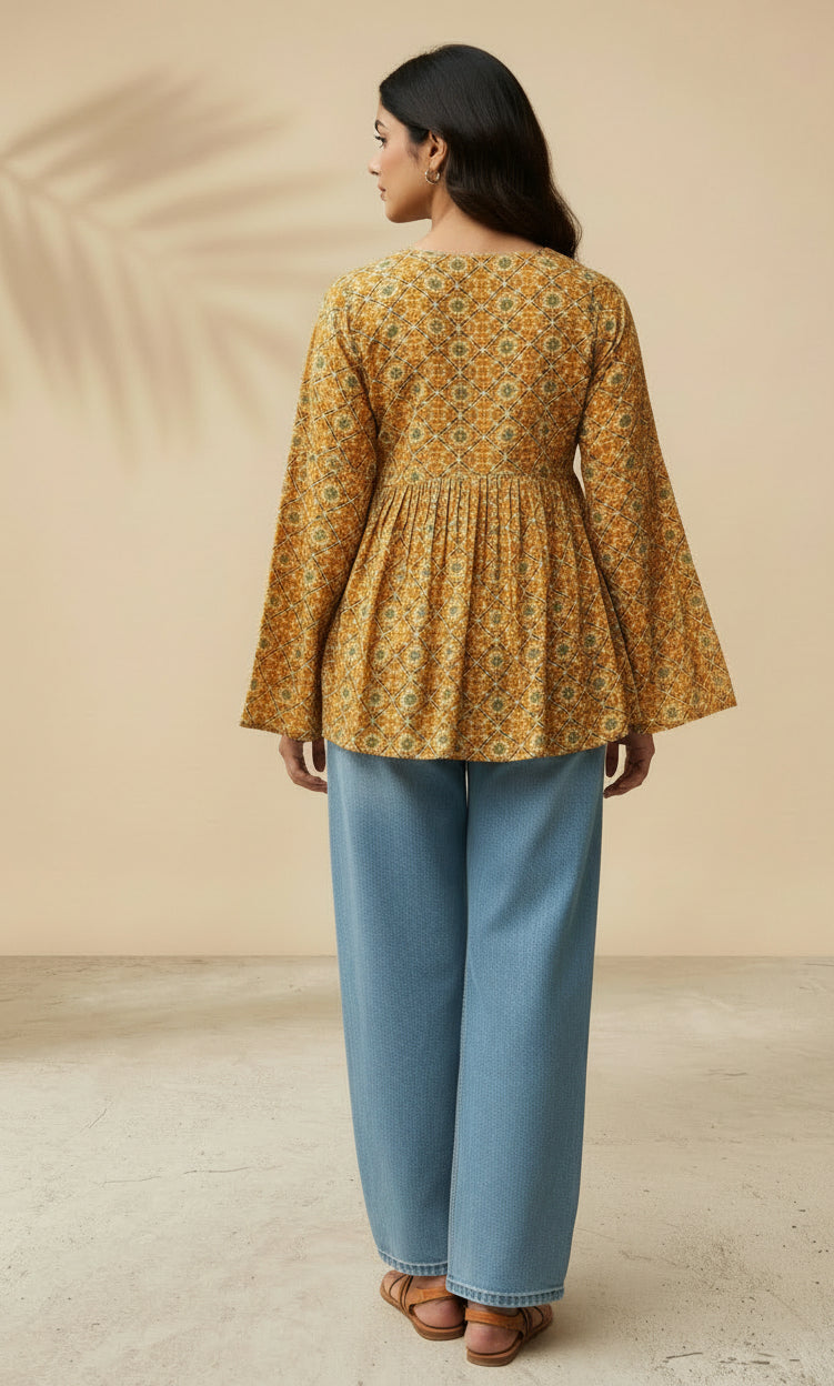 Back view of mustard cotton short kurti showing flare