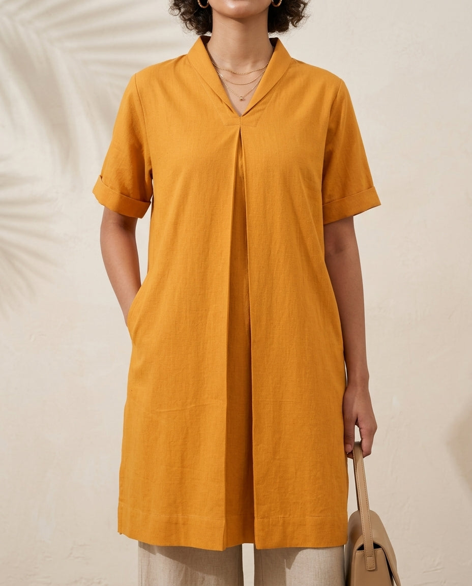 Swayra Mustard Box Fit Kurta, close-up of front box pleat, side pocket and short sleeves
