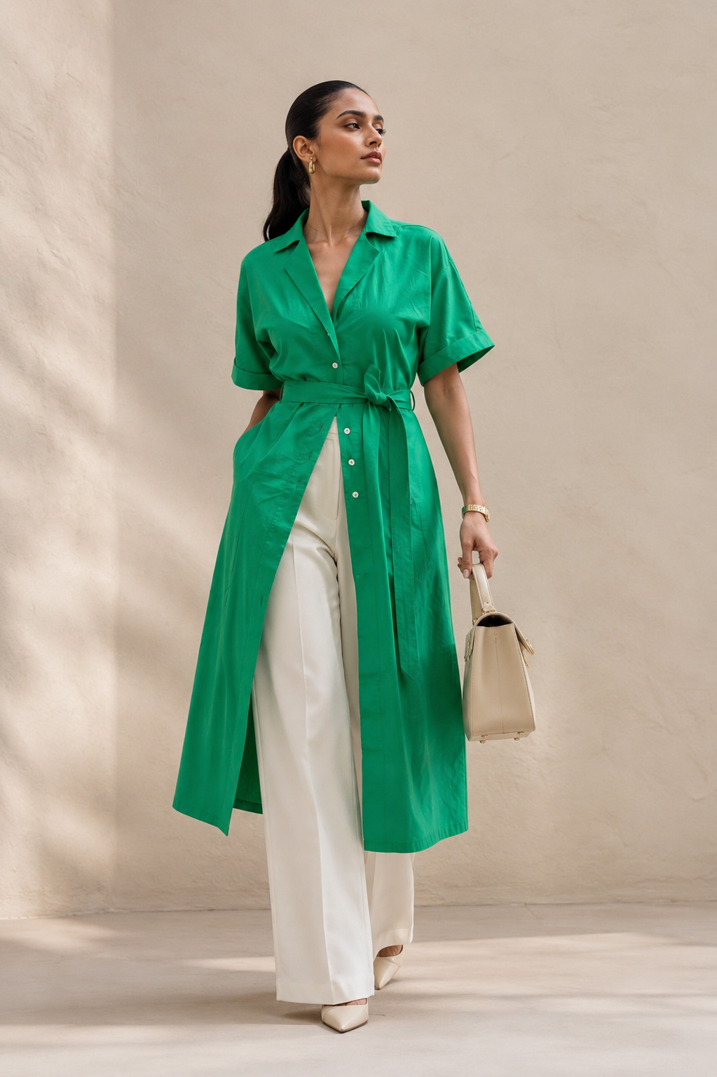 Parrot green belted shirt kurta, front view, revere collar and self-tie waist belt, styled with white wide-leg trousers and cream tote