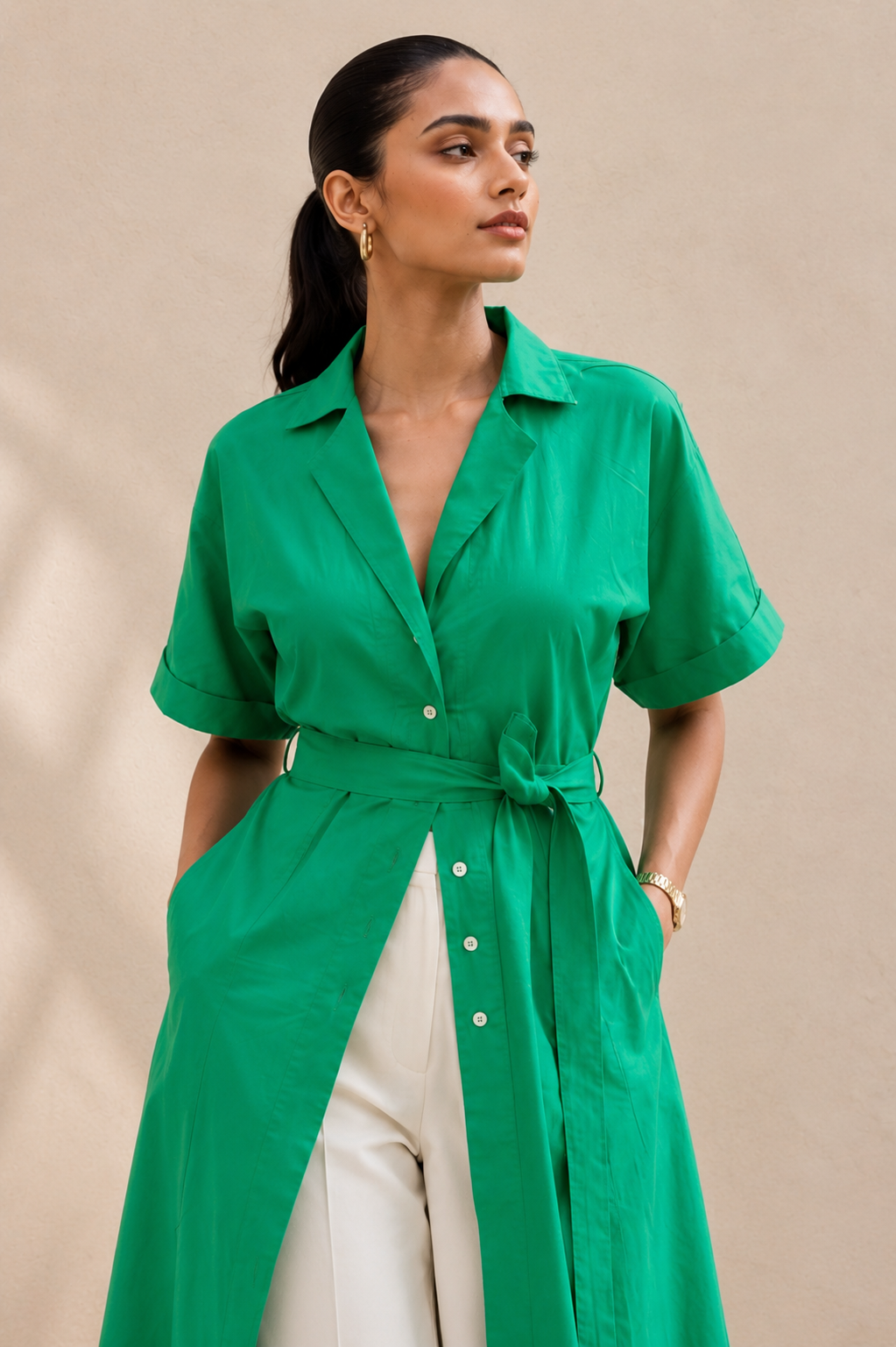 Close-up of parrot green shirt kurta showing 2-piece revere collar, front button placket and D-ring belt detail