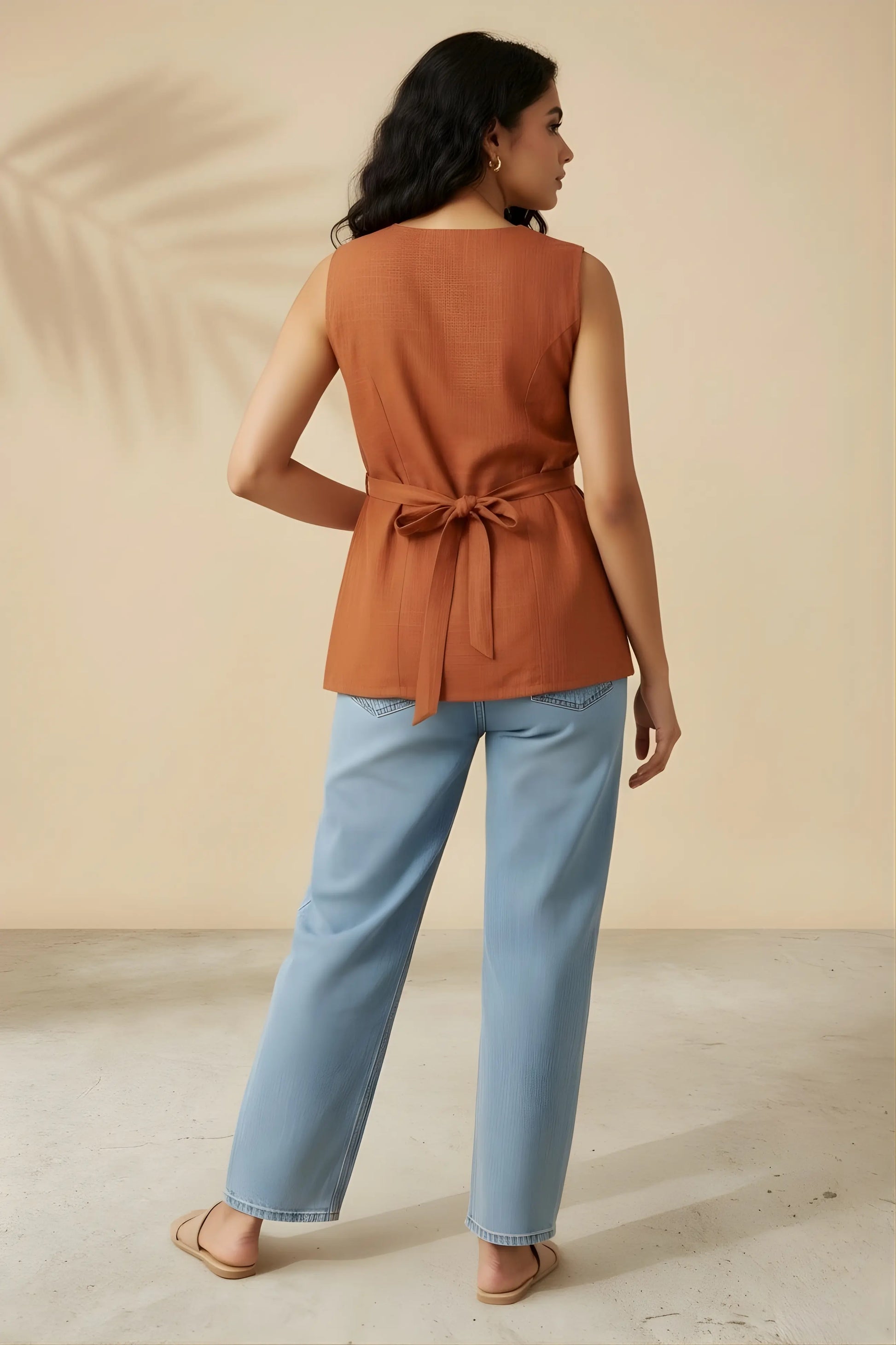 Back view of rust vest kurti showing adjustable back tie-up detail