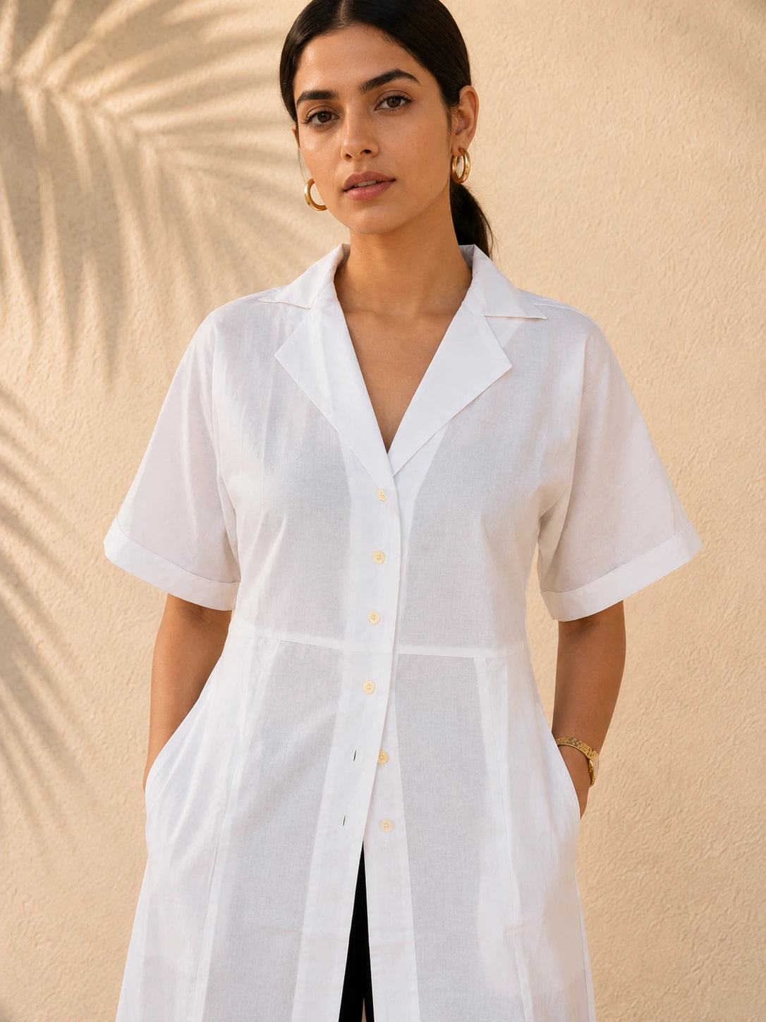 Close-up of white shirt kurta showing open collar, V-neck and off-white front button placket detail