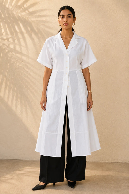 White A-line belted shirt kurta, full front view showing open collar, button placket and flared A-line silhouette with black wide-leg trousers