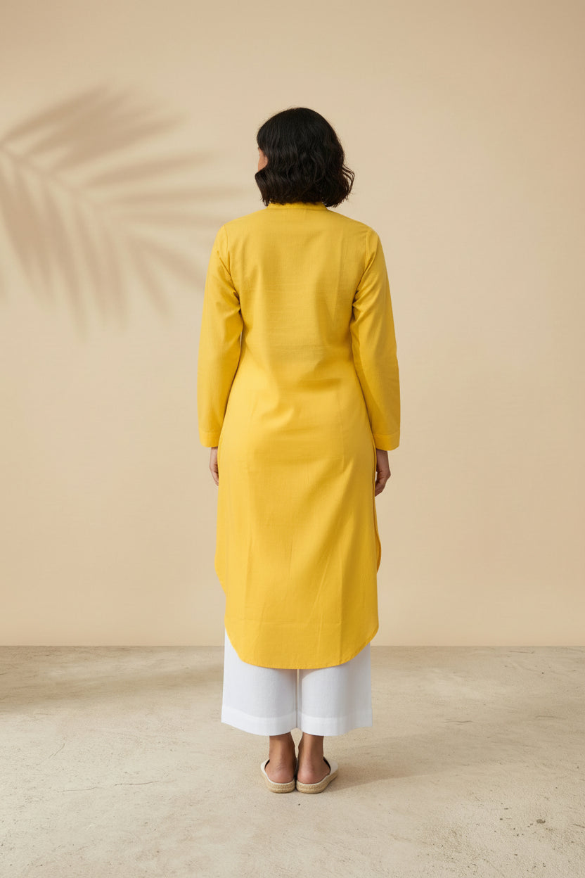 Back view of solid yellow cotton kurta showing straight cut